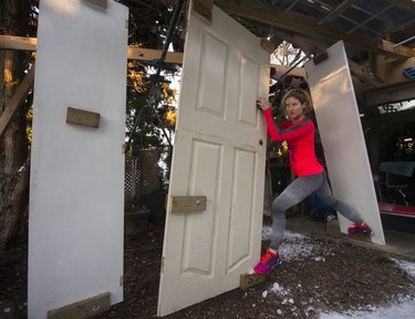 Fitness trainer Allison Tai moves through a portion of the obstacle course built in her east Vancouver backyard.