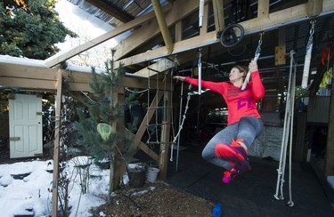 Fitness trainer Allison Tai moves through a portion of the obstacle course built in her east Vancouver backyard.