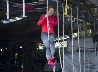 Fitness trainer Allison Tai moves through a portion of the obstacle course built in her east Vancouver backyard.