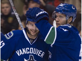 Sven Baertschi is congratulated by Bo Horvat on his short handed goal.