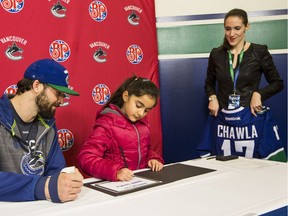 Saanvi Chawla, 7, of Abbotsford is one of the 34 lucky youngsters who signed a one-day contract with the Vancouver Canucks for the inaugural Canuck for a Day contest. Mark Yuen/PNG files