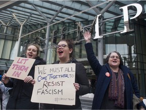 Protesters gather in front of the Trump Hotel to protest the US President's latest executive order restricting entry into the USA by citizens of seven predominantly Muslim countries, Vancouver, January 28 2017.