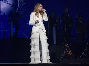 Celine Dion performs in concert at the Bell Centre in Montreal, Sunday, July 31, 2016. Celine Dion is teaming up with a Montreal-based company for her foray into the fashion world. The Canadian pop superstar announced the launch of her debut collection in partnership with handbag, luggage and accessory company The Bugatti Group. THE CANADIAN PRESS/Graham Hughes