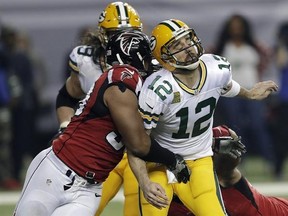 ADVANCE FOR WEEKEND EDITIONS, FEB. 4-5- FILE - In this Jan. 22, 2017, file photo, Atlanta Falcons defensive end Dwight Freeney (93) hits Green Bay Packers&#039; Aaron Rodgers after throwing a pass during the second half of the NFL football NFC championship game in Atlanta. New England has a bunch of young players, 16 with four years or fewer in the NFL, and the Falcons actually have four guys who have played in a Super Bowl: Dwight Freeney, Courtney Upshaw, Dashon Goldson and Philip Wheeler. (AP Phot