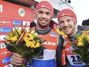 Germany&#039;s Tobias Wendl, left, and Tobias Arlt celebrate after they won the men&#039;s doubles event of the Luge World Cup in Oberhof, Germany, Saturday, Feb. 4, 2017. (Martin Schutt/dpa via AP)