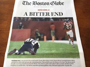 This Monday, Feb. 6, 2017, photo provided by Mary Tivnan shows a front page of an early edition of The Boston Globe in North Fort Myers, Fla. The front page of some early editions of New England&#039;s largest newspaper ran the headline, &ampquot;A Bitter End&ampquot; over an image of fallen New England Patriots quarterback Tom Brady, suggesting the Patriots lost to the Atlanta Falcons in Super Bowl 51. Boston-area editions ran the headline &ampquot;Win For The Ages&ampquot; and showed a triumphant Brady holding up the championship