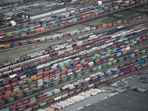 The country posted back-to-back monthly trade surpluses for the first time since September 2014, boosted by higher prices for exports of oil and natural gas in December, Statistics Canada said Tuesday. A freight train rail yard is pictured near Pitt Meadows, B.C., in a November 25, 2016, file photo. THE CANADIAN PRESS/Jonathan Hayward