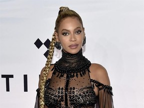 FILE - In this Oct. 15, 2016 file photo, singer Beyonce Knowles attends the Tidal X: 1015 benefit concert in New York. Beyonce is nominated for Grammy Awards for best album, best song and record of the year. (Photo by Evan Agostini/Invision/AP, File)