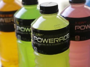 FILE - In this Monday, May 5, 2014, file photo, various flavors of Powerade, a Coca-Cola brand, are photographed in San Francisco. The Coca-Cola Company reports financial earnings Thursday, Feb. 9, 2017. (AP Photo/Jeff Chiu, File)