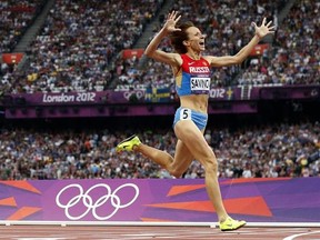 FILE - In this Aug. 11, 2012 file photo Russia&#039;s Mariya Savinova crosses the finish line to win gold in the women&#039;s 800-meter final during the athletics in the Olympic Stadium at the 2012 Summer Olympics, London. Savinova has been banned for four years for doping by the Court of Arbitration for Sport on Friday, Feb. 10, 2017 and stripped of the Olympic gold medal from 2012. (AP Photo/Matt Dunham, file)