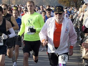 FILE - In this Nov. 14, 2010 file photo, Don McNelly (90), of Irondequoit, N.Y., competes in the 2010 Harrisburg Marathon in Harrisburg, Pa. McNelly, an internationally known runner who completed 744 marathons has died, he was 96. The Richard H. Keenan Funeral Home in Fairport, N.Y., says he died Sunday, Feb. 5, 2017. (AP Photo/Daniel Shaknen)