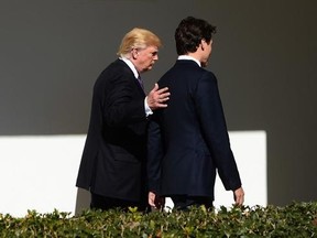 Prime Minister Justin Trudeau walks with U.S. President Donald Trump down the West Wing Colonnade of the White House , in Washington, D.C., on Monday, Feb. 13, 2017. THE CANADIAN PRESS/Sean Kilpatrick