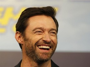 FILE - In this March 7, 2016, file photo, actor Hugh Jackman smiles during a press conference in Seoul, South Korea. Jackman posted a selfie on social media Feb. 13, 2017, showing off his bandaged nose following treatment for skin cancer. (AP Photo/Lee Jin-man, File)