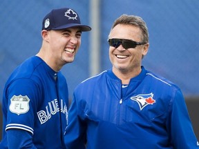 Toronto Blue Jays starting pitcher Aaron Sanchez, left, and manager John Gibbons laugh during baseball spring training in Dunedin, Fla., on Wednesday, February 15, 2017. THE CANADIAN PRESS/Nathan Denette