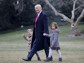 President Donald Trump walks with his grandchildren Arabella Kushner and Joseph Kushner to Marine One on the South Lawn of the White House in Washington, Friday, Feb. 17, 2017, for a short trip to Andrews Air Force Base, Md., then onto South Carolina and Florida. (AP Photo/Pablo Martinez Monsivais)