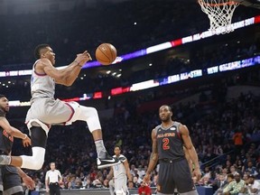 Eastern Conferences forward Giannis Antetokounmpo of the Milwaukee Bucks (34) goes for a layup against Western Conference forward Anthony Davis of the New Orleans Pelicans (23) and Western Conference forward Kawhi Leonard of the San Antonio Spurs (2) during the first half of the NBA All-Star basketball game in New Orleans, Sunday, Feb. 19, 2017. (AP Photo/Gerald Herbert)