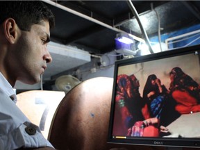 Pakistani journalist Haseeb Khawaja watches a video of girls clapping that had dire repercussions for those who were filmed, in a scene from the documentary Unveiled: The Kohistan Video Scandal, part of the 2017 Vancouver International Women in Film Festival.