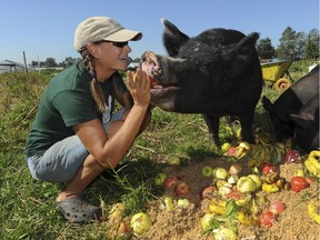 Julia Smith of Blue Sky Ranch with her Berkshire pigs.