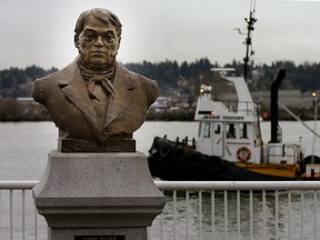 A statue of explorer Simon Fraser stands outside of the New West market.