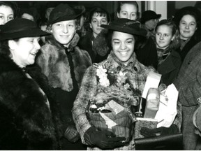 Vancouver sprinter Barbara Howard is surrounded by friends as she leaves for the 1938 British Empire Games in Sydney, Australia.