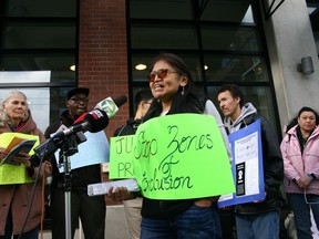 Downtown Eastside resident Erica Cynthia Grant speaks at a news conference on Main Street outside Dalina café on Feb. 22, where the Carnegie Community Action Project launched a report into gentrification in the area.