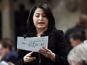Maryam Monsef, minister of Democratic Institutions, stands in the House of Commons during Question Period on Parliament Hill in Ottawa on Dec. 1, 2016.