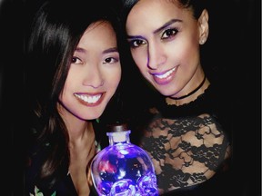 Glowing like the TV screens where they're usually seen, a skull-head bottle of Crystal Head Aurora vodka illuminated Sophie Lui and Sonia Beeksma in the Hotel Georgia's Prohibition bar.