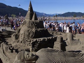 Sand sculptors Damon Langlois (in red shirt) and Ted Siebert doing a commissioned work in Miami Beach in 2105 for Turkish Airlines. Guinness recognized it as the record tallest sand sculpture.