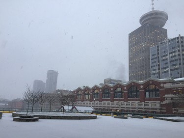 Snow falling in Downtown Vancouver Friday morning.