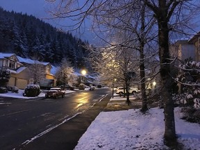 Snow covers the ground in Coquitlam Friday morning.