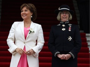 British Columbia's Lieutenant Governor Judith Guichon, right, and Premier Christy Clark look on from the steps of the Legislature Building before the start of the speech from the throne Tuesday, February 14, 2017 in Victoria, B.C.