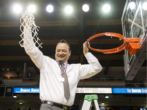 Kelowna Owls head coach Harry Parmar cuts the net after they defeated Tamanawis to win the 2016 Boys 'AAAA' High School Basketball Championships.