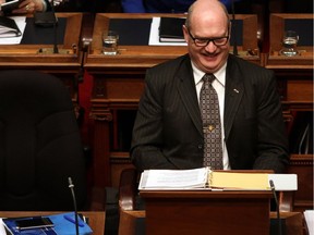 B.C. Finance Minister Michael de Jong smiles before delivering a balanced budget for a fifth year in a row at Legislative Assembly in Victoria, B.C. Tuesday, February 21, 2017.
