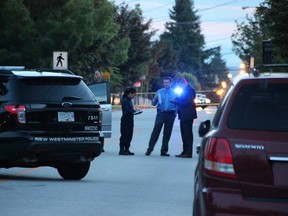 Police investigate the scene of the killing of Charan Dhandwar in the 1500-block 8th Avenue in New Westminster on June 3, 2015.