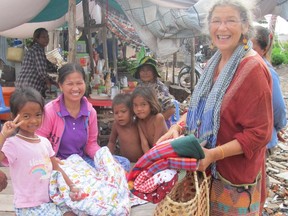 Eloise Charet on a trip to Cambodia in 2012, giving away quilts made by Doukhabors in the Slocan Valley.