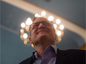 NDP MP Peter Julian listens as he's introduced before announcing he will run for the leadership of the federal New Democratic Party, during a news conference in New Westminster, B.C., on Sunday February 12, 2017.