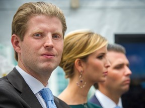 Donald Trump's children Eric Trump, left, Ivanka Trump, centre, and Donald Trump Jr., right, on the stage at the announcement of the Trump International Hotel & Tower on Georgia Street in Vancouver Wednesday, June 19, 2013. (Ric Ernst file photo / PNG)