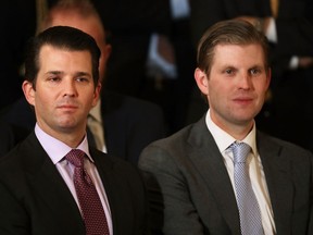 Donald Trump Jr. (left) and Eric Trump, sons of U.S. President Donald Trump, at a White House ceremony on Jan. 31, 2017.