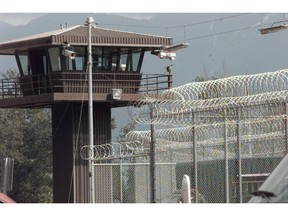 A watchtower oversees the Kent prison complex and augments the razor wire security fence.