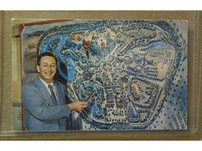 Walt Disney shows off Disneyland in a vintage photo from a  Disney exhibit at the Surrey Museum.