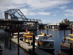 The Johnson Street Bridge Replacement Project, is seen beside the old Blue Bridge in Victoria, B.C., Friday, June 10, 2016. Known locally as the Blue Bridge for its light blue paint job, the new bridge was originally scheduled to open to traffic in September 2015.