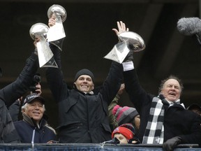 The New England Patriots’ 'triple crown’ of perennials: Owner Robert Kraft, quarterback Tom Brady and head coach Bill Belichick (left to right) at the team’s rally in Boston on Tuesday for the newly minted (and now five-time) Super Bowl champions.