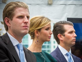 Donald Trump's children Eric Trump, left, Ivanka Trump, center and Donald Trump Jr., right on the stage at the announcement of the Trump International Hotel & Tower on Georgia Street in Vancouver Wednesday, June 19, 2013.