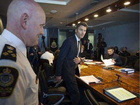 Mayor Gregor Robertson attends a recent police board meeting with police chief Adam Palmer.