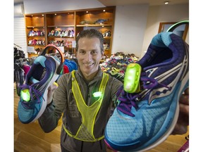 Rand Clement of The RIGHT Shoe in Kitsilano, shows off new safety lights that can clip on to shoes, to keep runners safer in the dark. Clement also emphasized the importance of comfortable and proper fitting runners to enhance training for the 33rd annual Vancouver Sun Run.