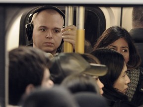 Commuters pack the SkyTrain Evergreen Line in this file photo.