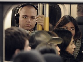 Commuters on packed Evergreen Line train on it's first rush day at Commercial Drive Station n Vancouver, BC., December 5, 2016.