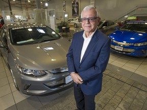 Dennis Rogoza, CEO of BC Scrap-It, with electric Chevy Volt cars at Dueck GM in Vancouver, BC Wednesday, February 1, 2017.
