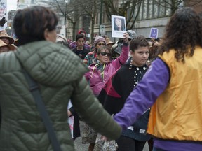 Thousands attend the 27th annual Women's Memorial March in Vancouver on Tuesday. The march is to remember women who have died owing to physical, mental and emotional violence.