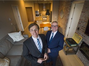 Theo Birkner (left) and partner Greg Paddy inside a suite that will be auctioned, in New Westminster, B.C. February 15, 2017. Harcourts Canada wants to introduce auctions as a way of buying and selling property in Vancouver.